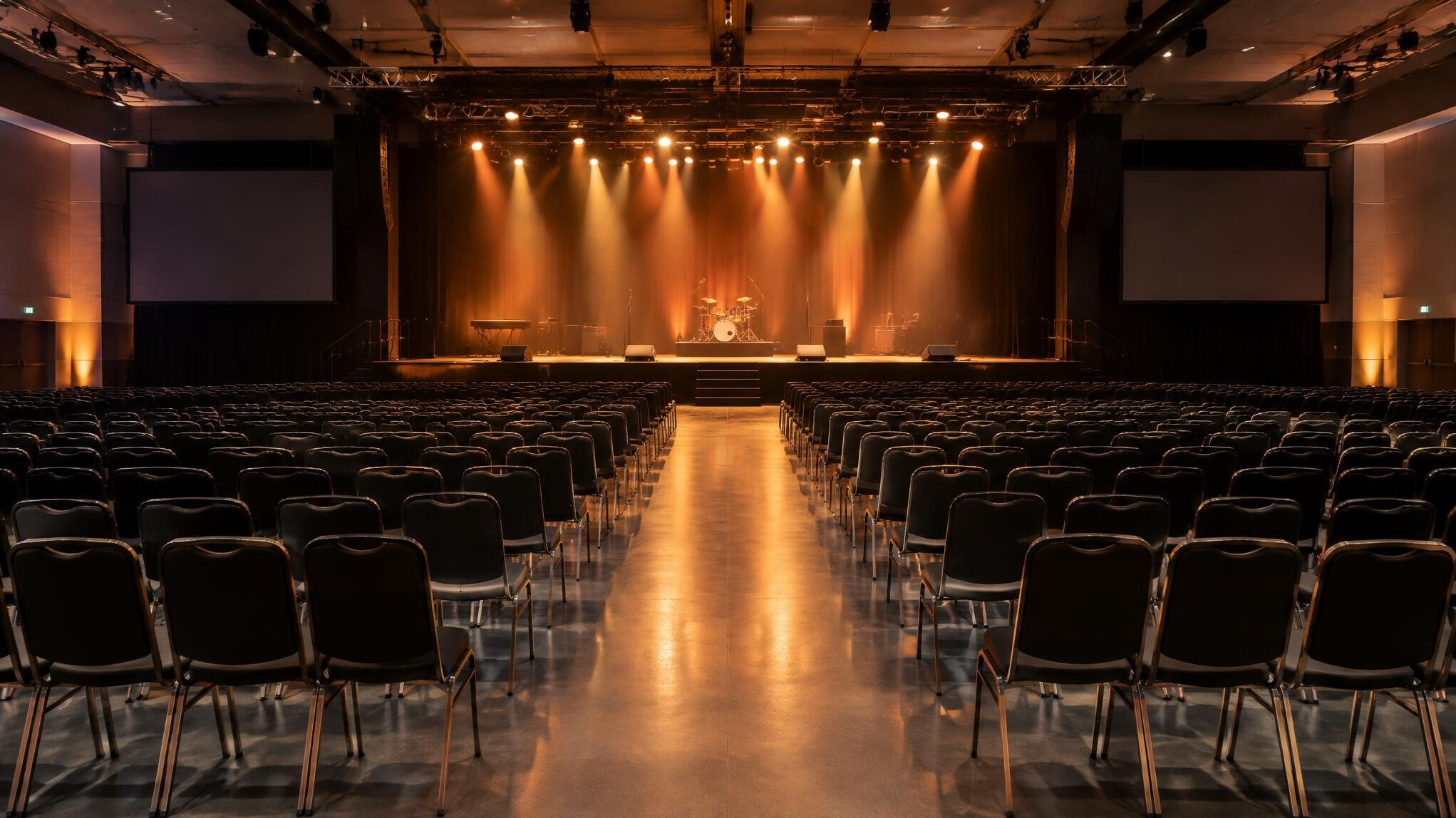 Large event hall with stage lighting before a show
